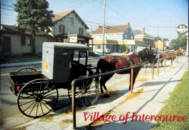 A horse drawn carriage is shown with the caption of "Village of Intercourse"